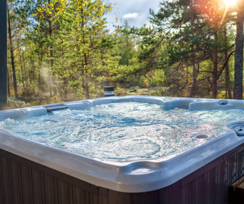 Outdoor hot tub surrounded by trees